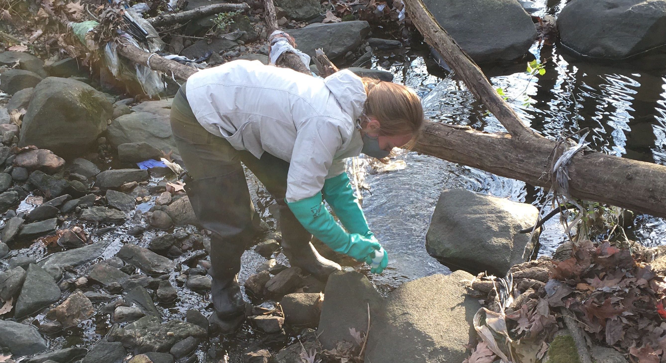 Mary McWilliams collecting Dead Run samples for water quality analysis