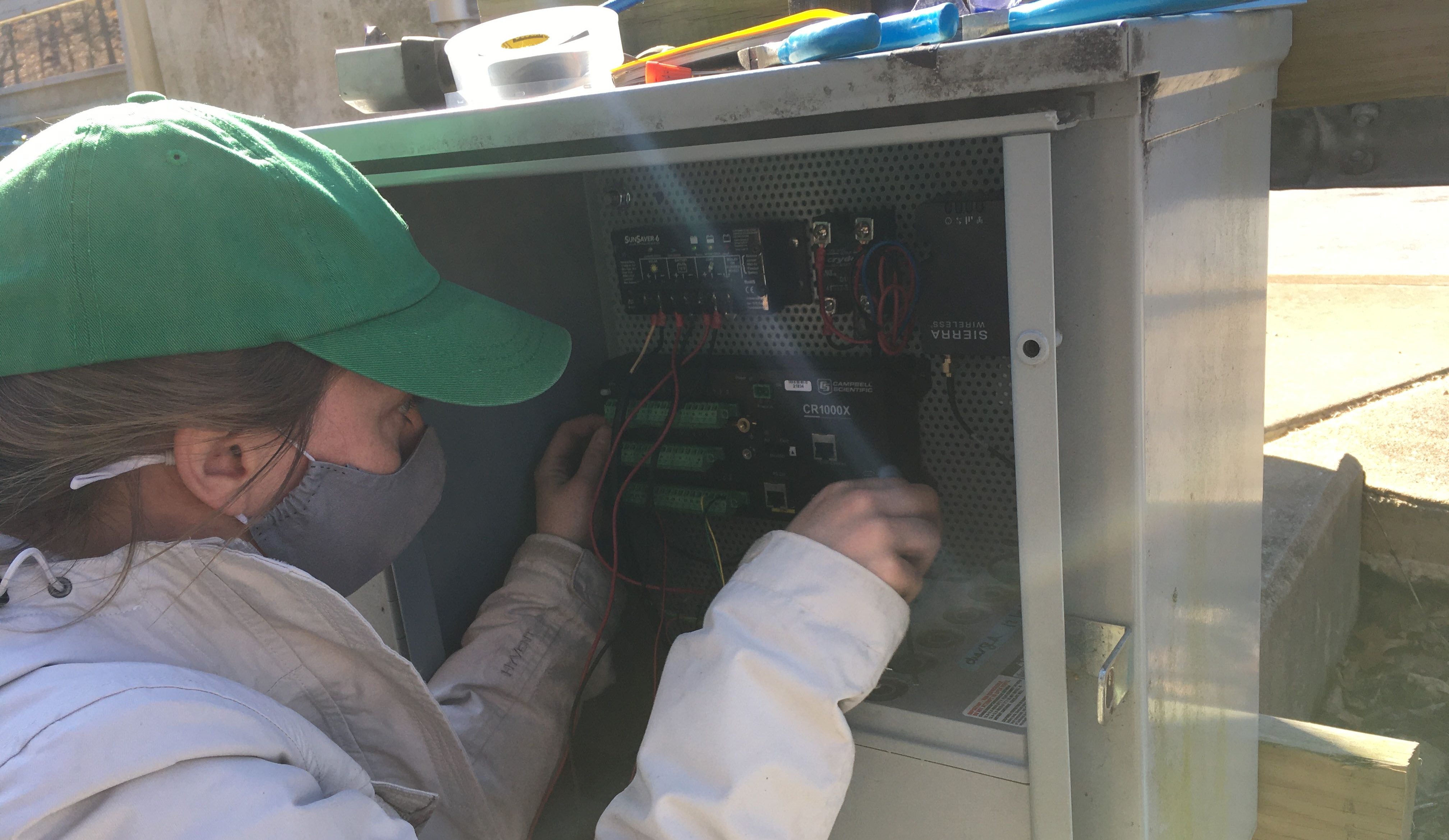 Mary McWilliams adjusting wiring for new CO2 sensor in Dead Run.
