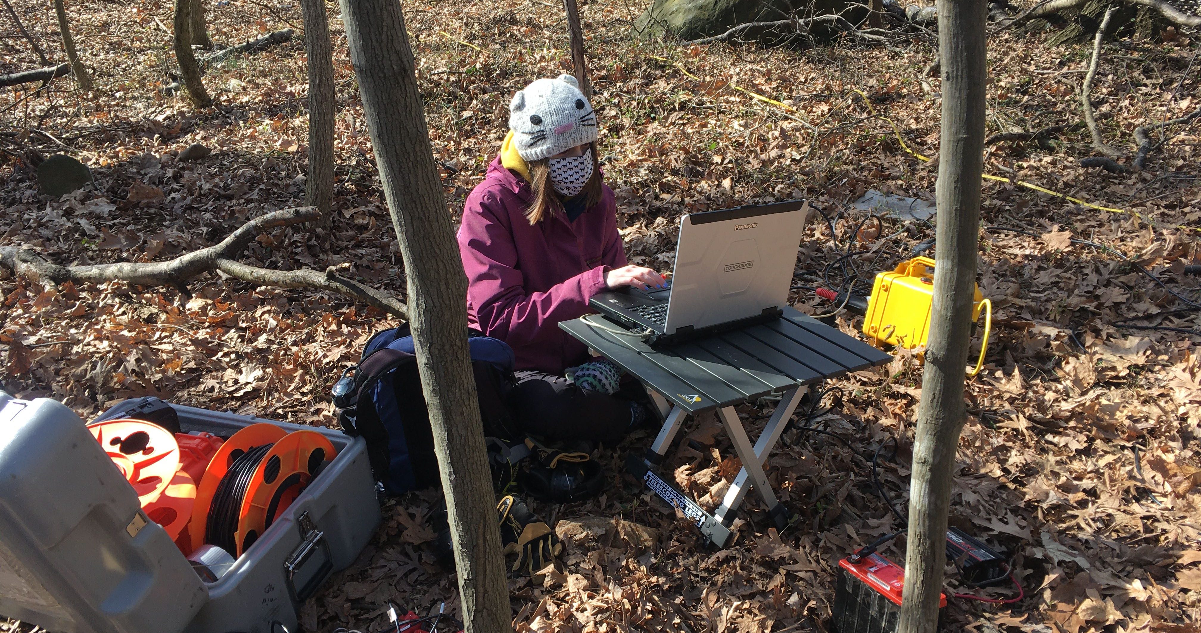 Berit Hudson-Rasmussen collecting seismic data as it is being generated at a Dead Run field site.